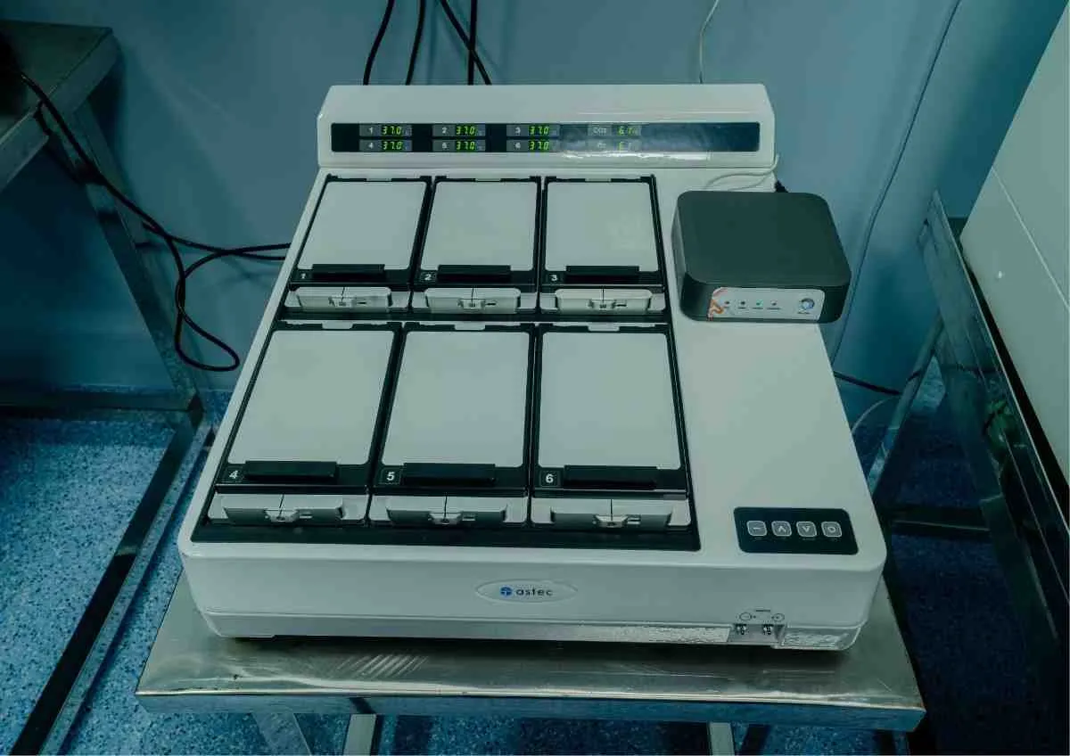 Lab technician working with equipment